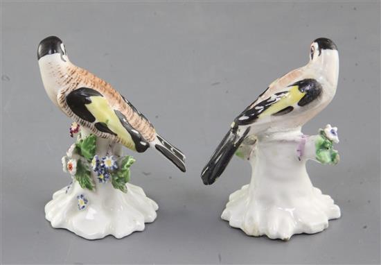 A near pair of Derby figures of goldfinches, c.1765-70, h. 6.3 and 6.5cm, one restored